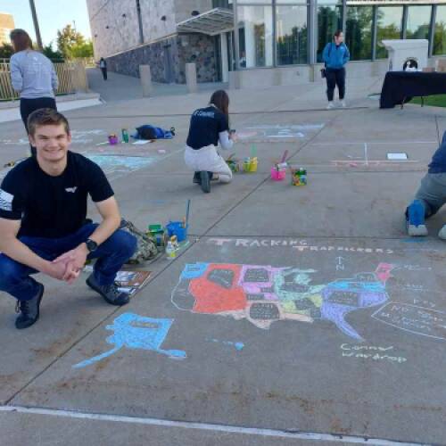 Psychology major Connor Wardrop presents at GVSU Chalk Art Symposium
